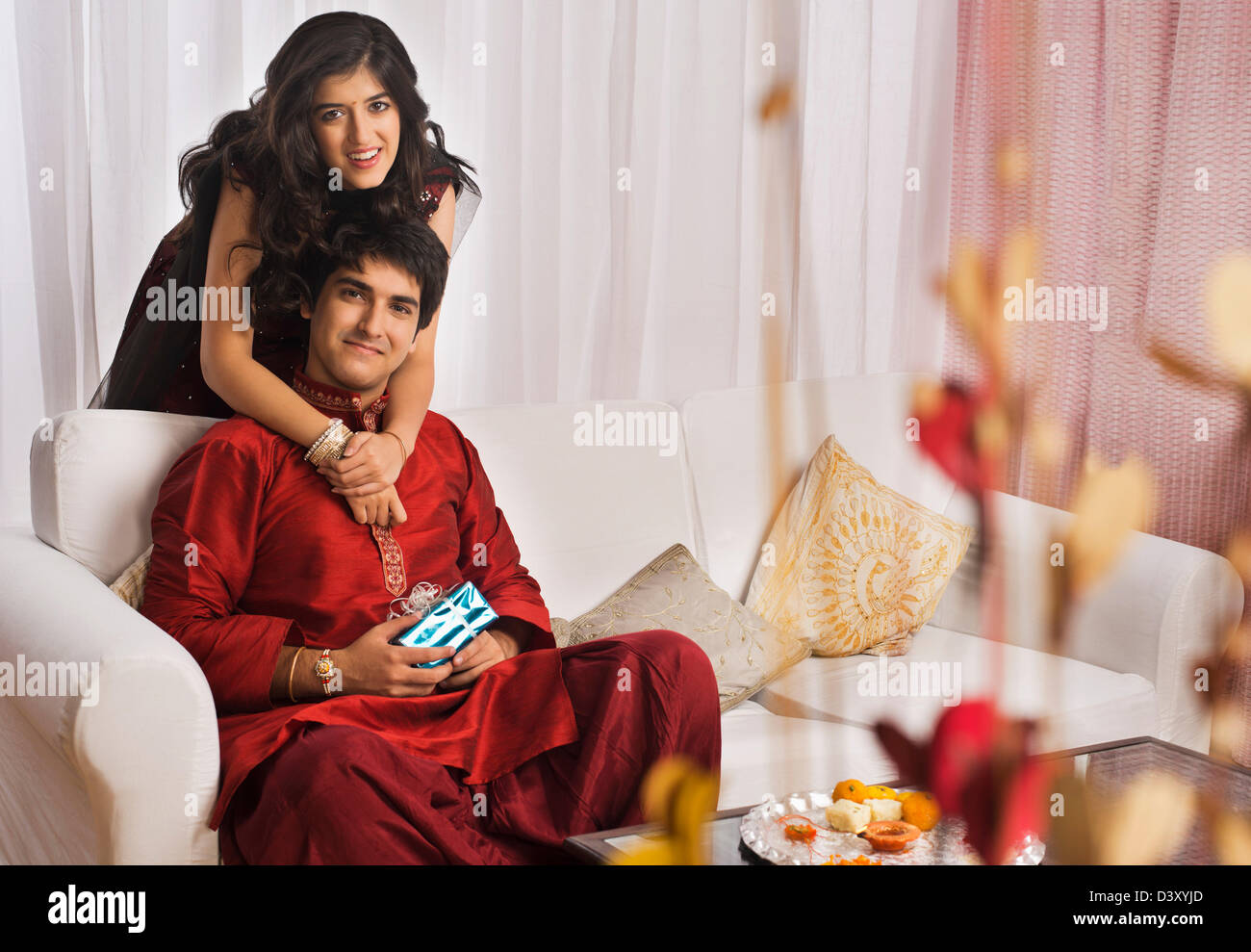 Image of Asian Indian Young Family Of Four Celebrating Diwali, Bhai Dooj Or Raksha  Bandhan-HP362719-Picxy