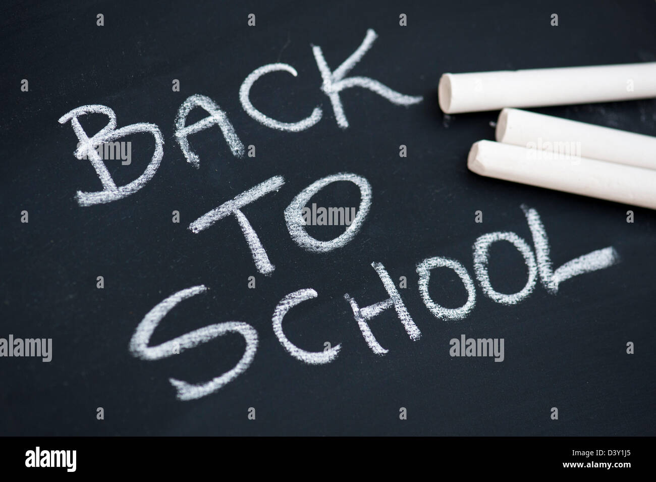 Back to school written with chalk on a chalkboard. India Stock Photo