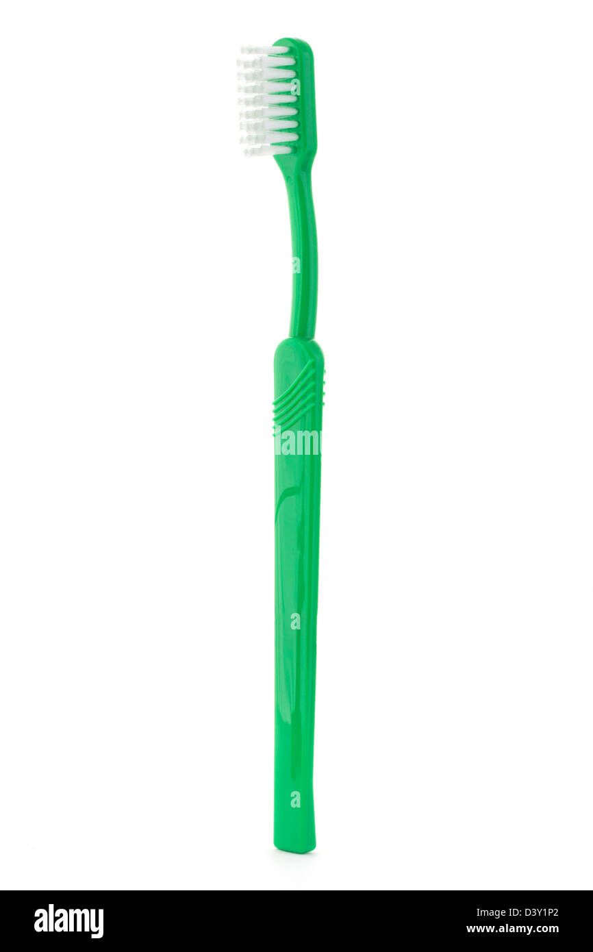 Single green toothbrush on a white background Stock Photo