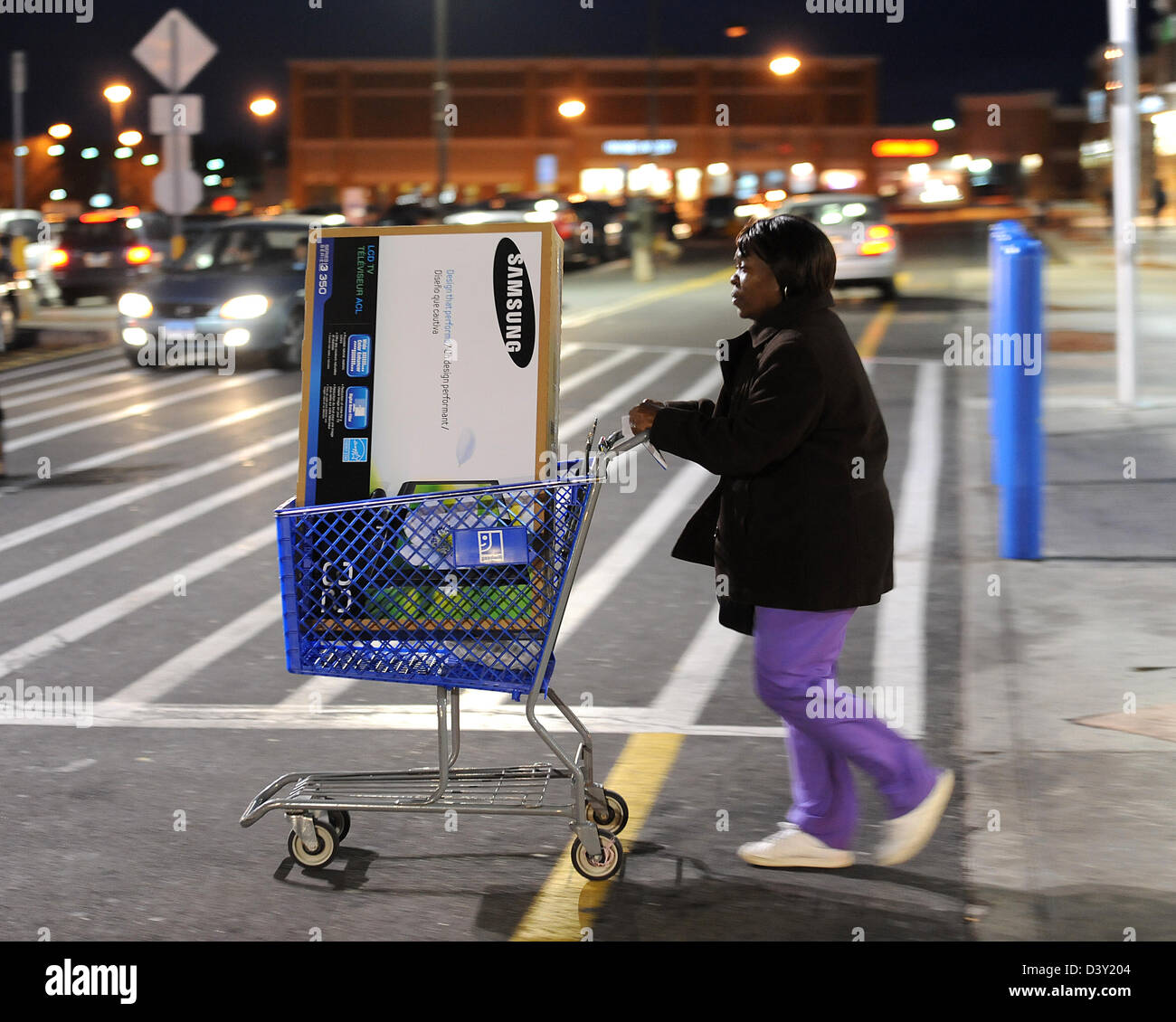 Last minute Christmas shopping, a woman leaves a Wal-Mart store on Christmas eve in CT USA Stock Photo
