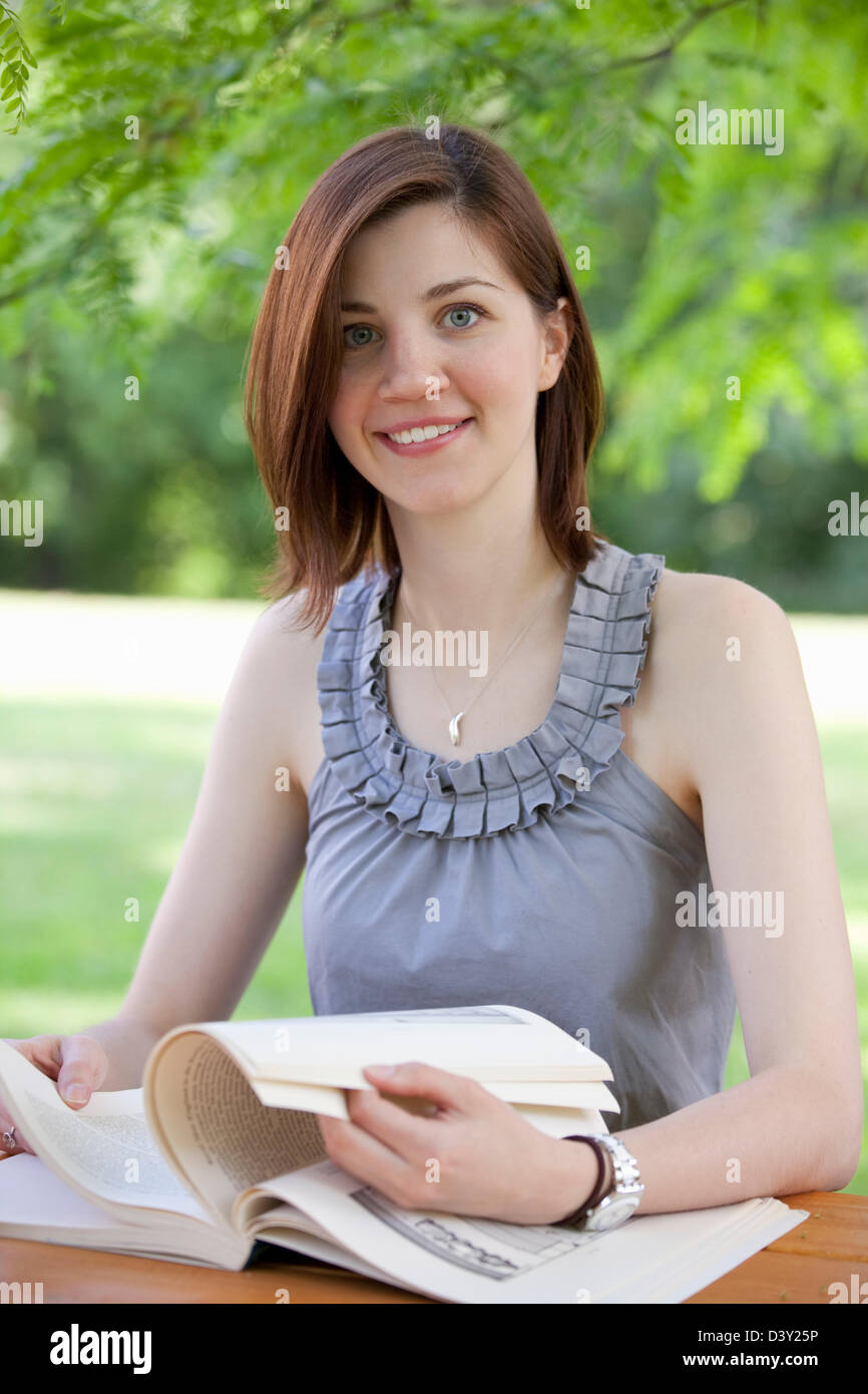 portrait of a female teenager with book Stock Photo - Alamy