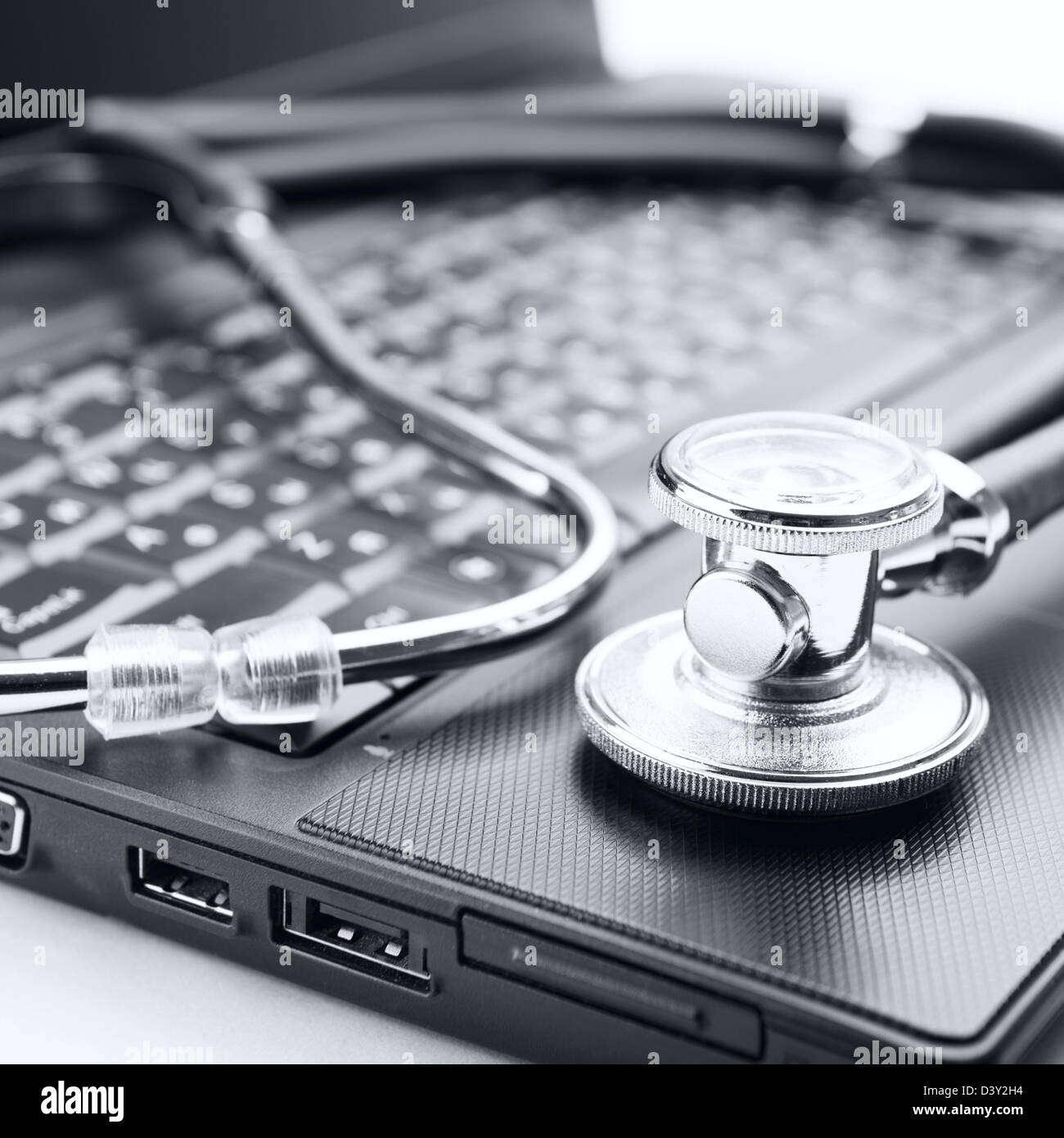Concept of diagnostic. Stethoscope and laptop Stock Photo