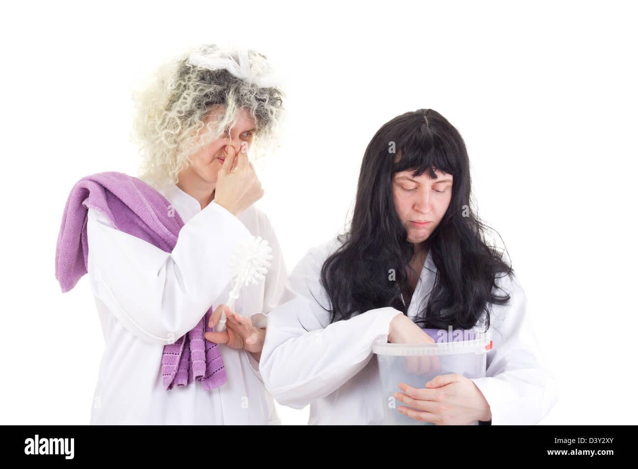 Female cleaners in white work coats Stock Photo