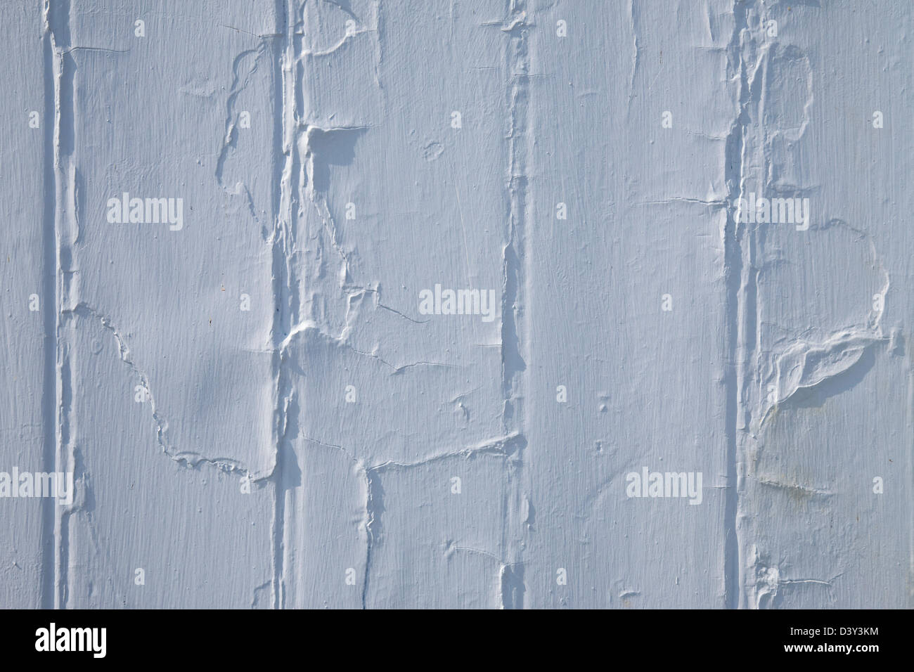 Light blue flaking paint on a wooden beach hut, abstract. Stock Photo