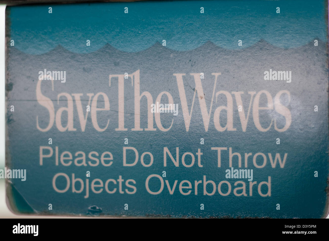 A sign about not throwing objects on the ocean. Royal Caribbean slogan