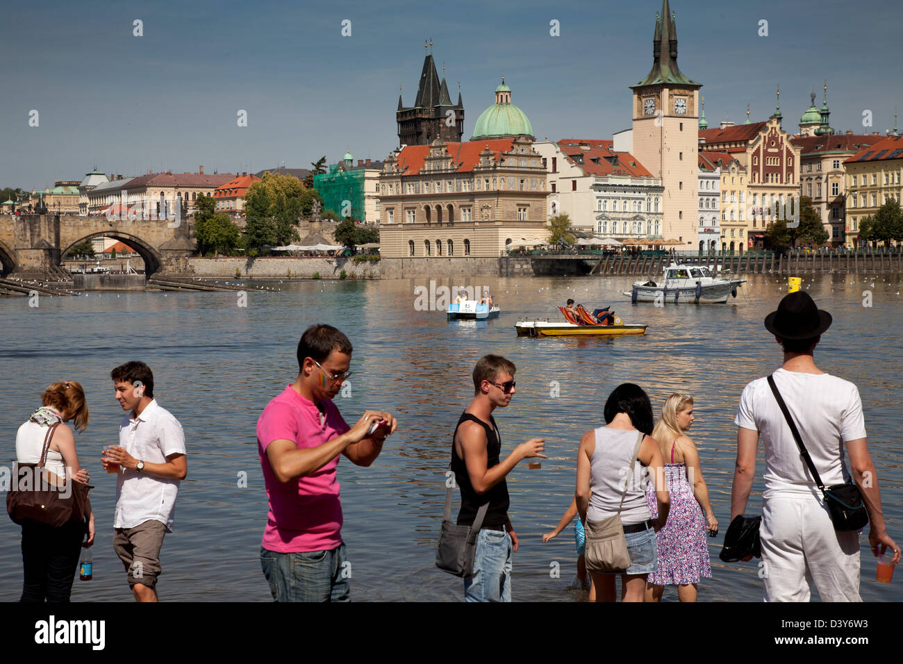 Young People Stand In Vltava River Opposite Charles Bridge During Gay Stock Photo Alamy