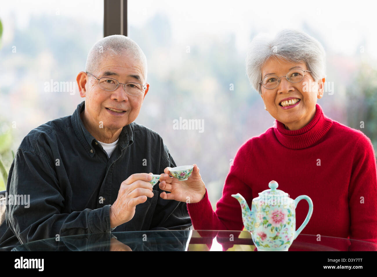 Chinese couple having tea together Stock Photo Alamy