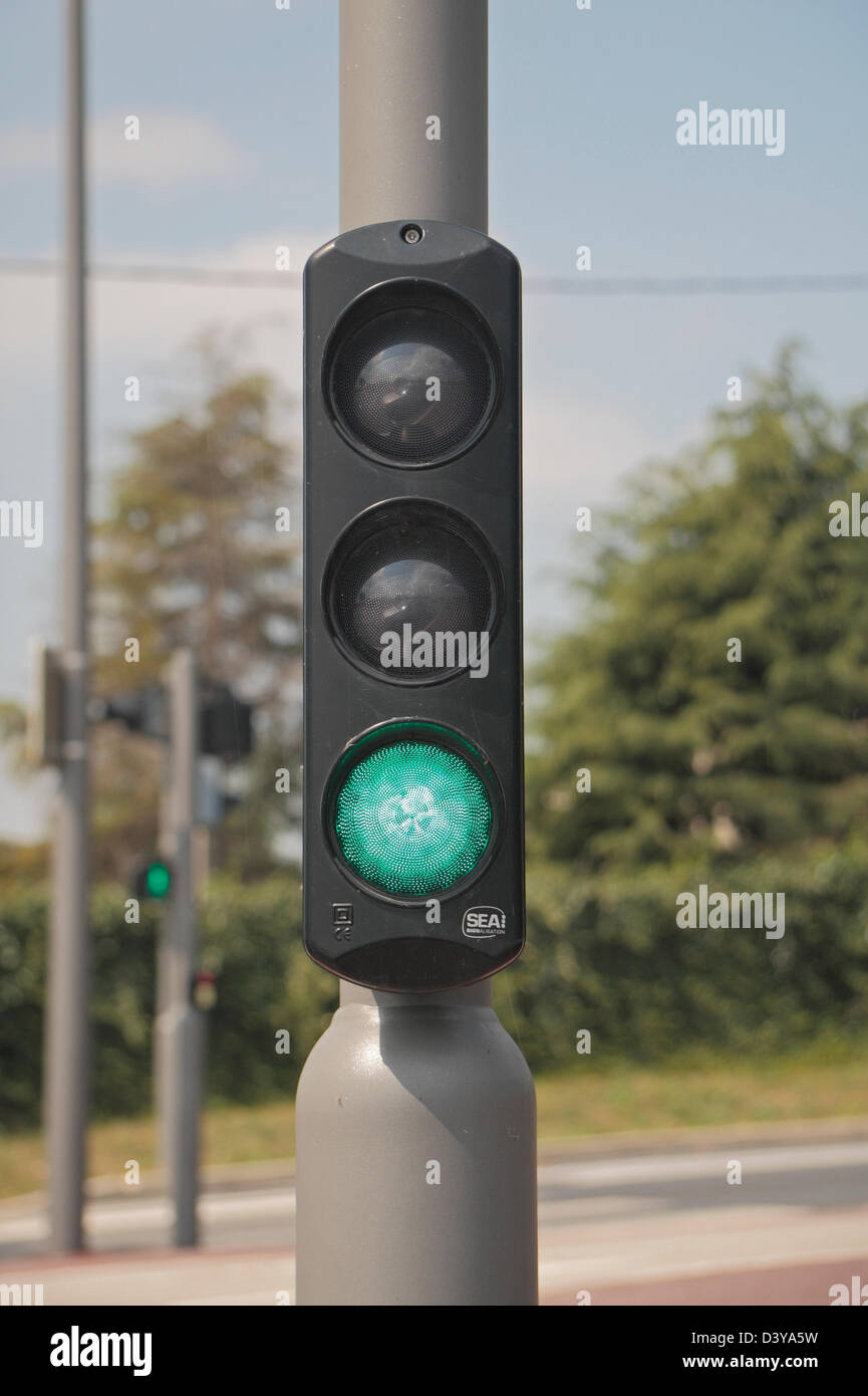 A set of small traffic lights at cyclist eye level on a post in northern France. Stock Photo