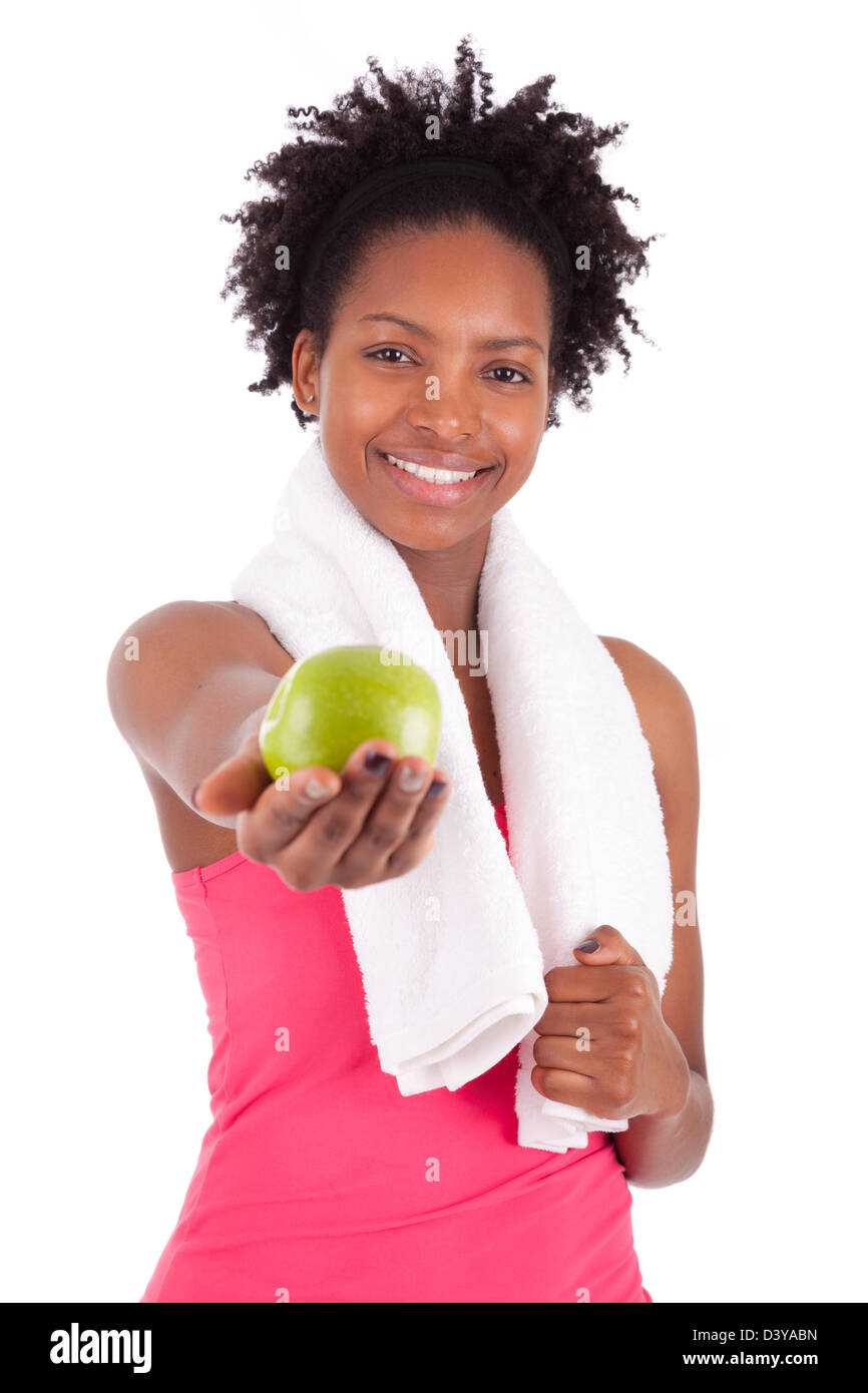 Young african american woman holding an apple over white background Stock Photo
