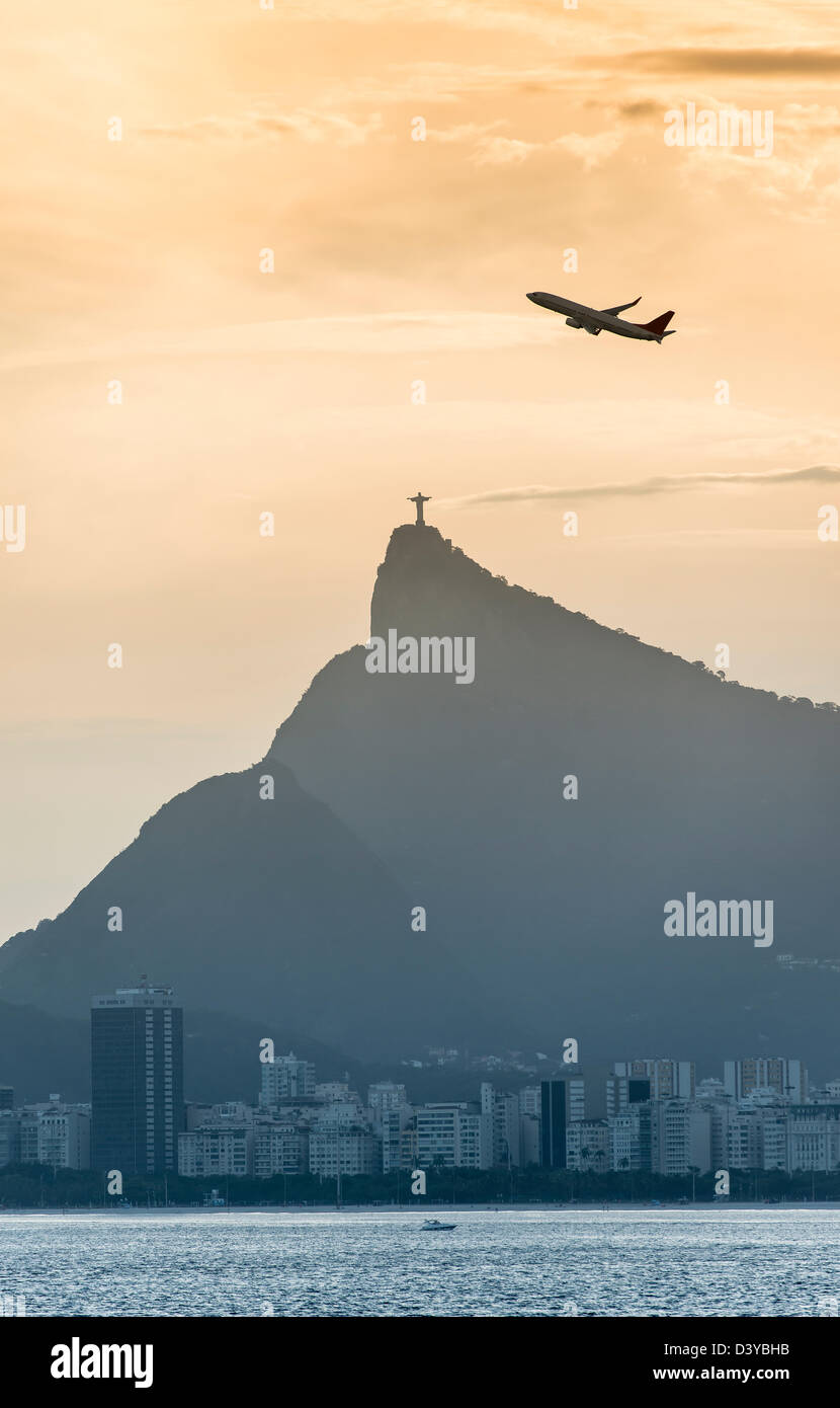 Airplane over rio de janeiro city scape with Christ de Redeemer Stock Photo