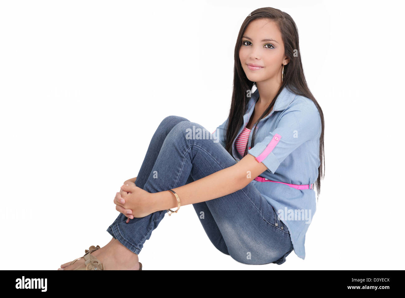 Happy college girl sitting on floor Stock Photo - Alamy