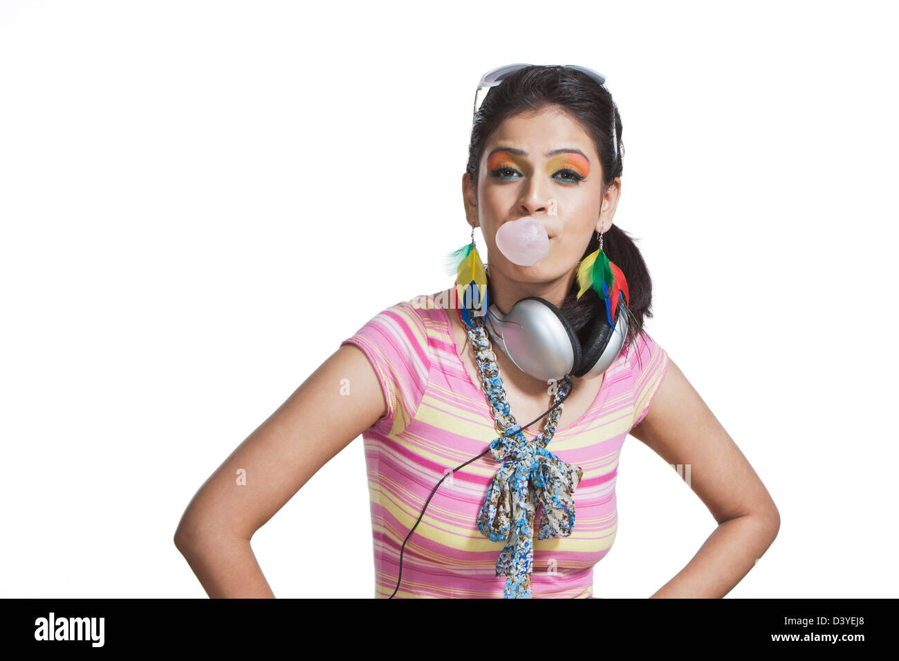 Beautiful young woman blowing bubble gum Stock Photo - Alamy