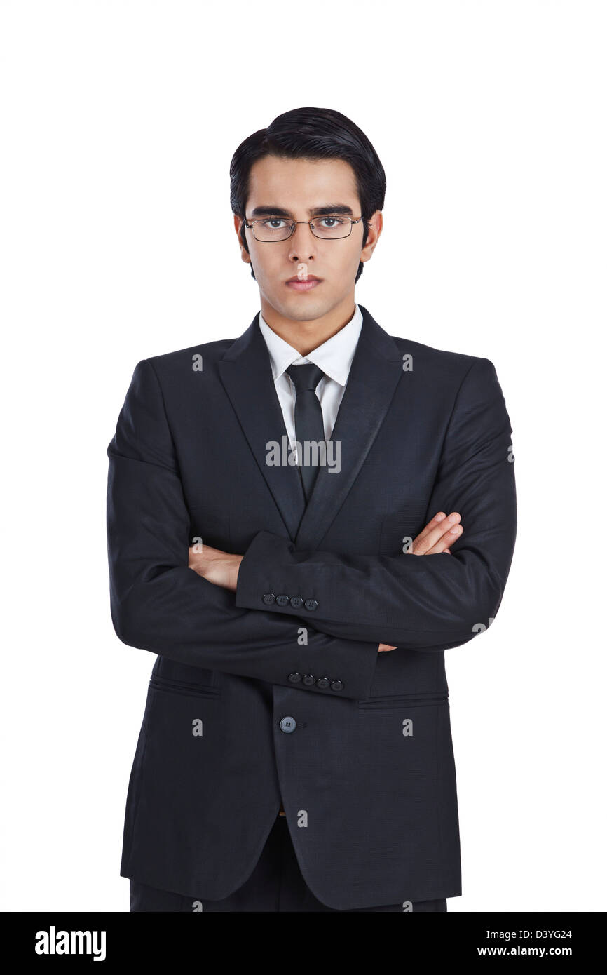 Portrait of a businessman standing with his arms crossed Stock Photo ...