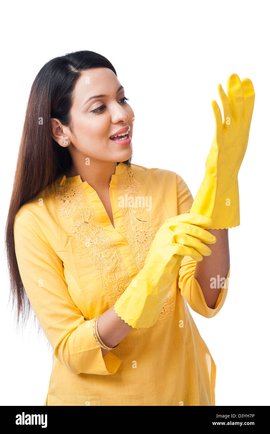 Woman wearing gloves and smiling Stock Photo - Alamy