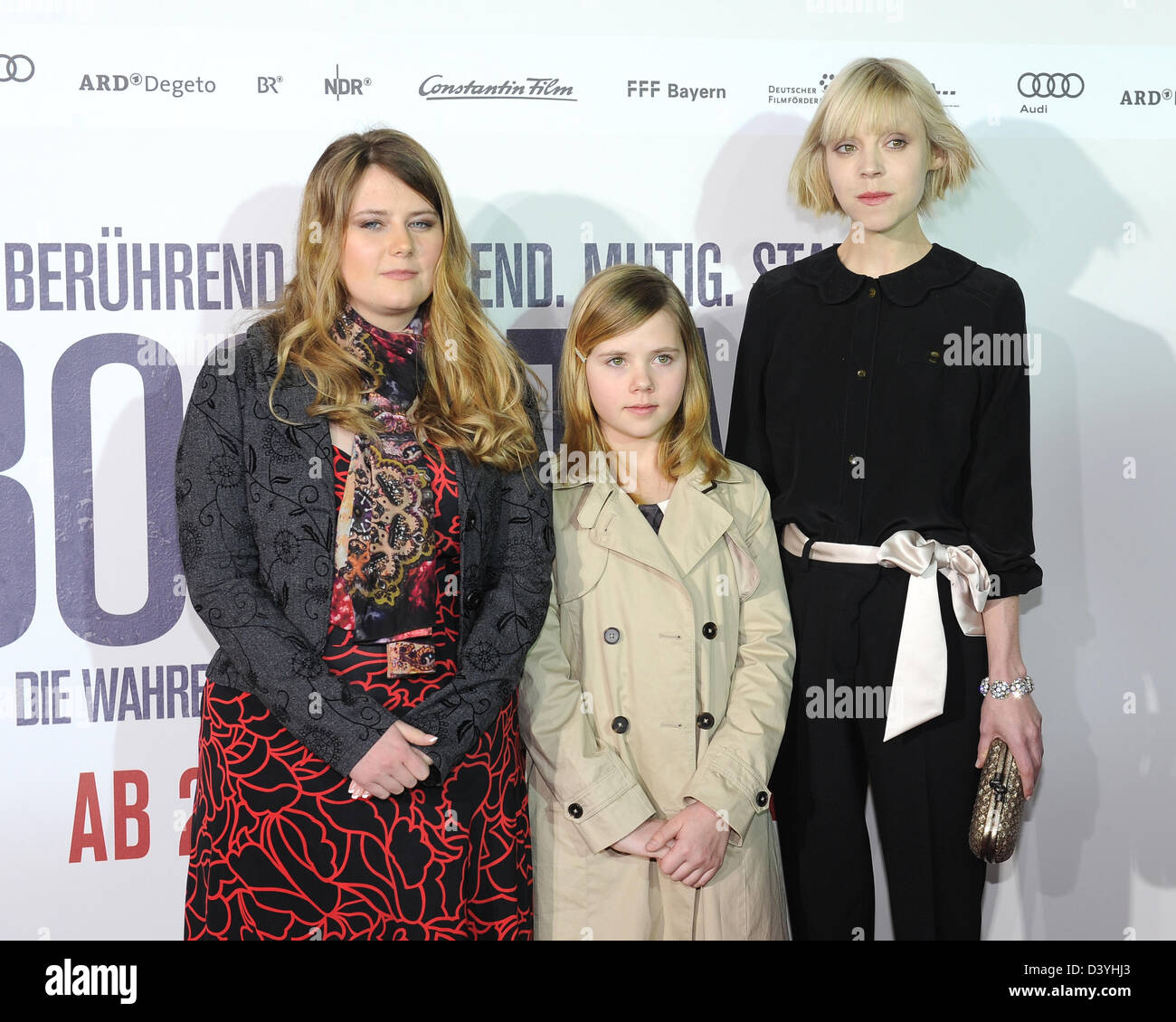 Munich, Germany. 26th February 2013. The former abduction victim Natascha Kampusch (L)  and actress Amelia Pidgeon, who plays the part of Kampush as a littel girl, and actress  Antonia Campbell- Hughes, who plays Kampush as a grown-up, attend the premier of the film '3096 Tage' (3096 Days) in Munich, Germany, 26 February 2013. The film retells the story of Kampusch and her abduction. The film will start in cinemas across Germany on 28 February 2013. Photo: Ursula Dueren/dpa/Alamy Live News Stock Photo