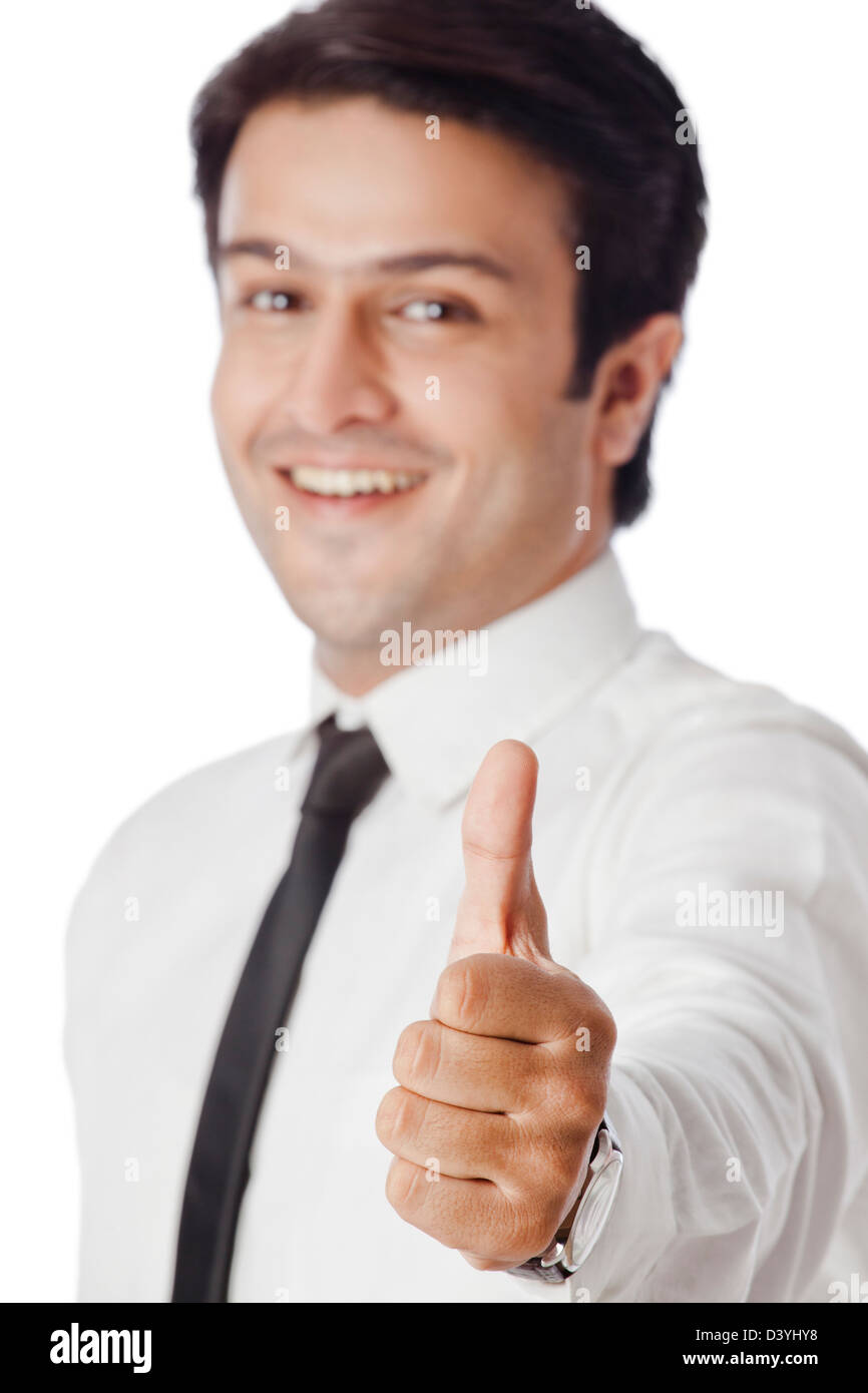 Businessman gesturing thumbs up sign Stock Photo - Alamy