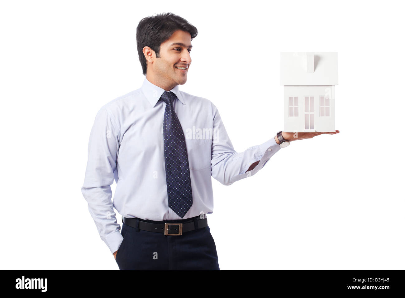 Businessman holding a model home Stock Photo - Alamy