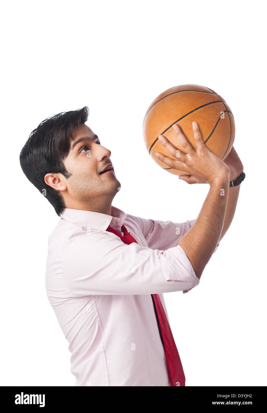 Businessman throwing a basketball Stock Photo Alamy
