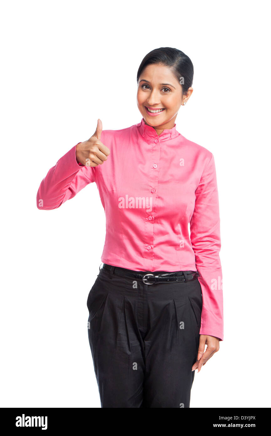 Portrait of a businesswoman showing thumbs up sign Stock Photo - Alamy