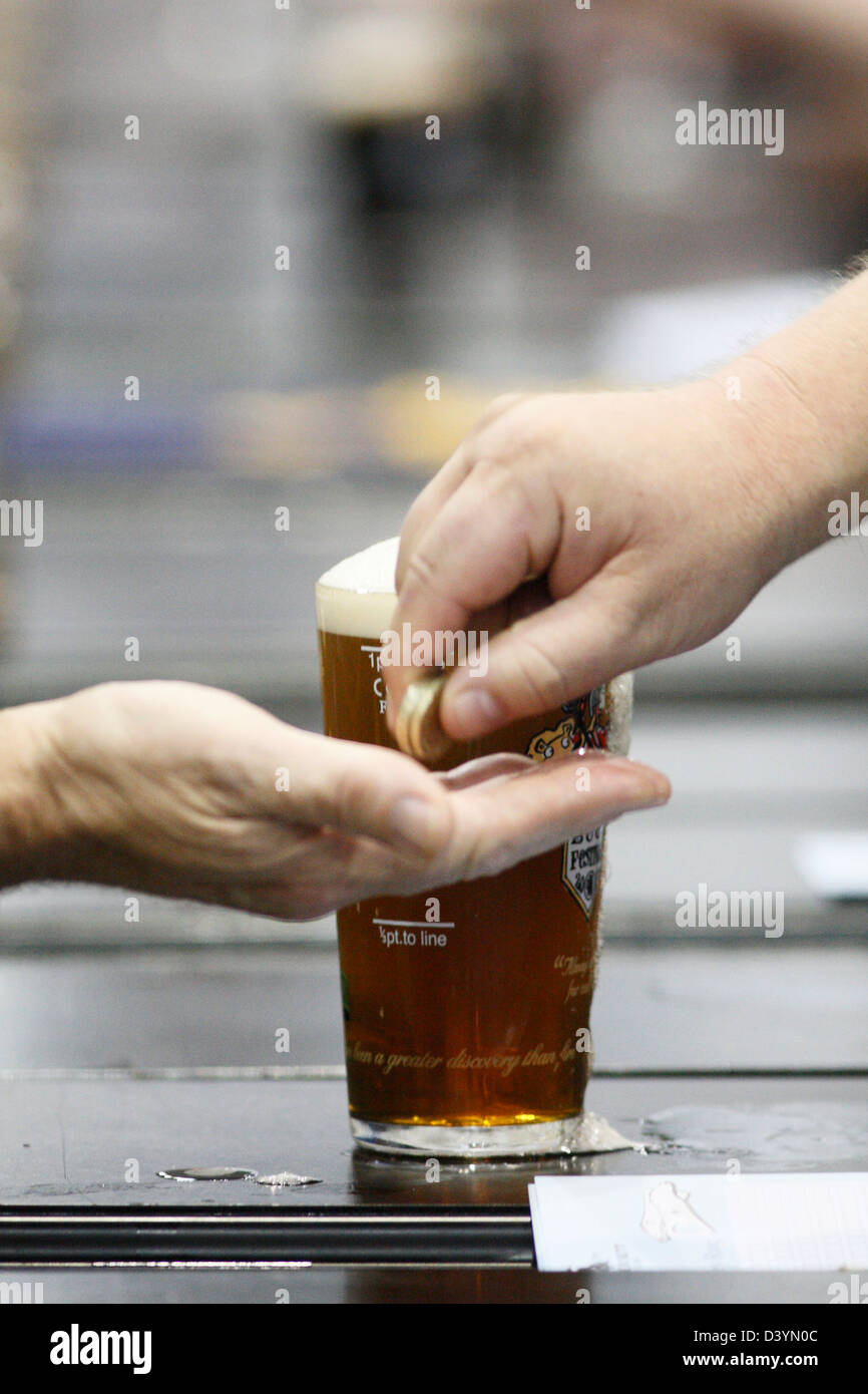 Buying a pint of bitter at The Great British Beer Festival, Earls Court, London. Stock Photo