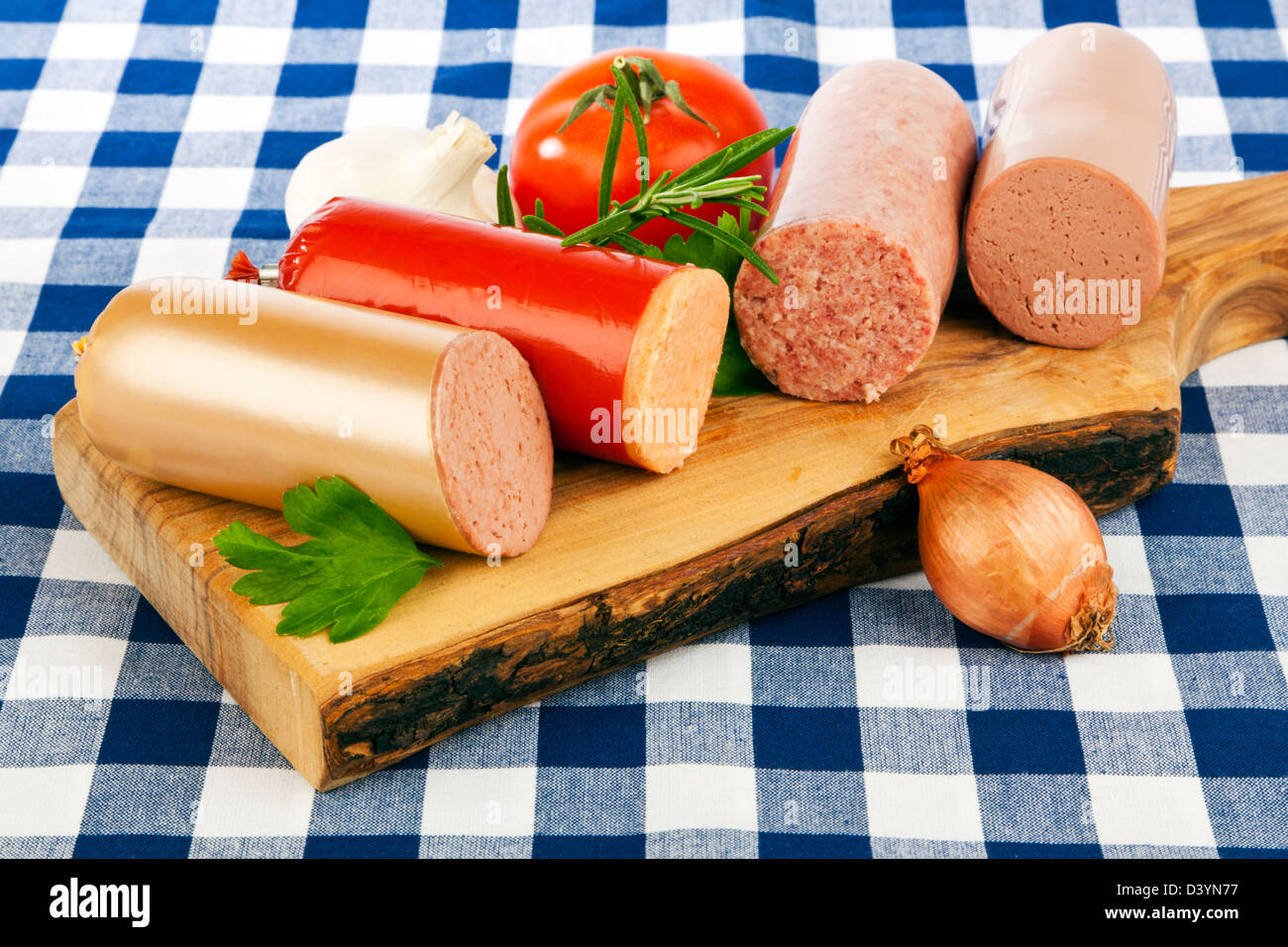 Assortment of german sausages on wooden platter Stock Photo