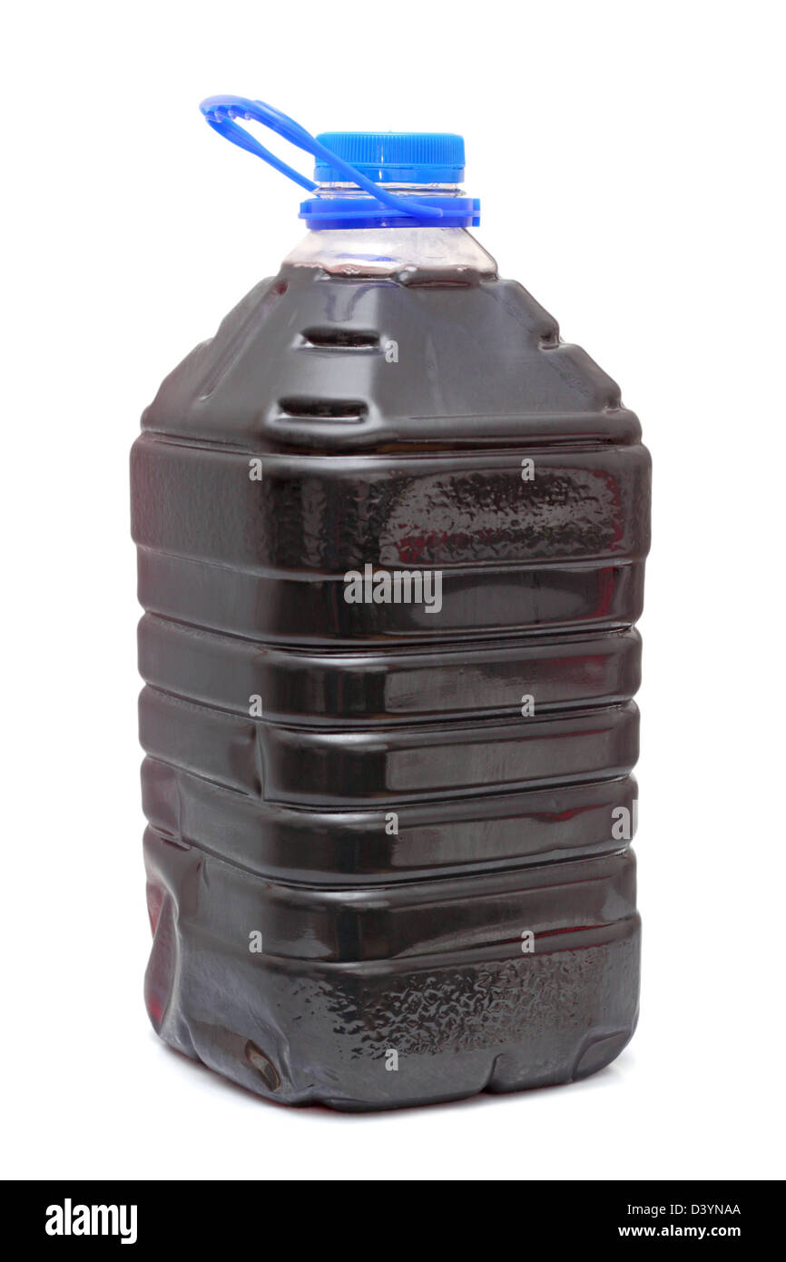 homemade red wine in plastic container with blue cap over white background Stock Photo Alamy