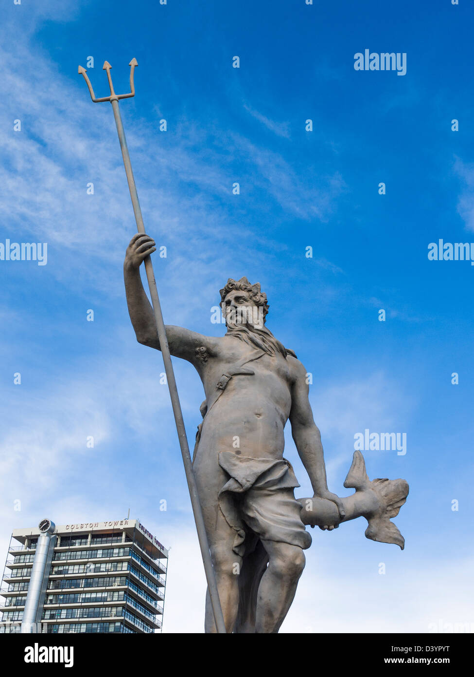 The statue of Neptune in the Bristol City centre with Colston Tower in