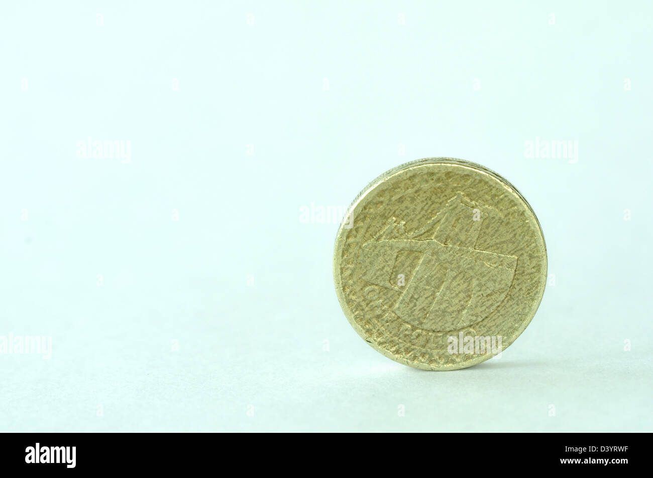 A one pound coin on its edge UK Stock Photo