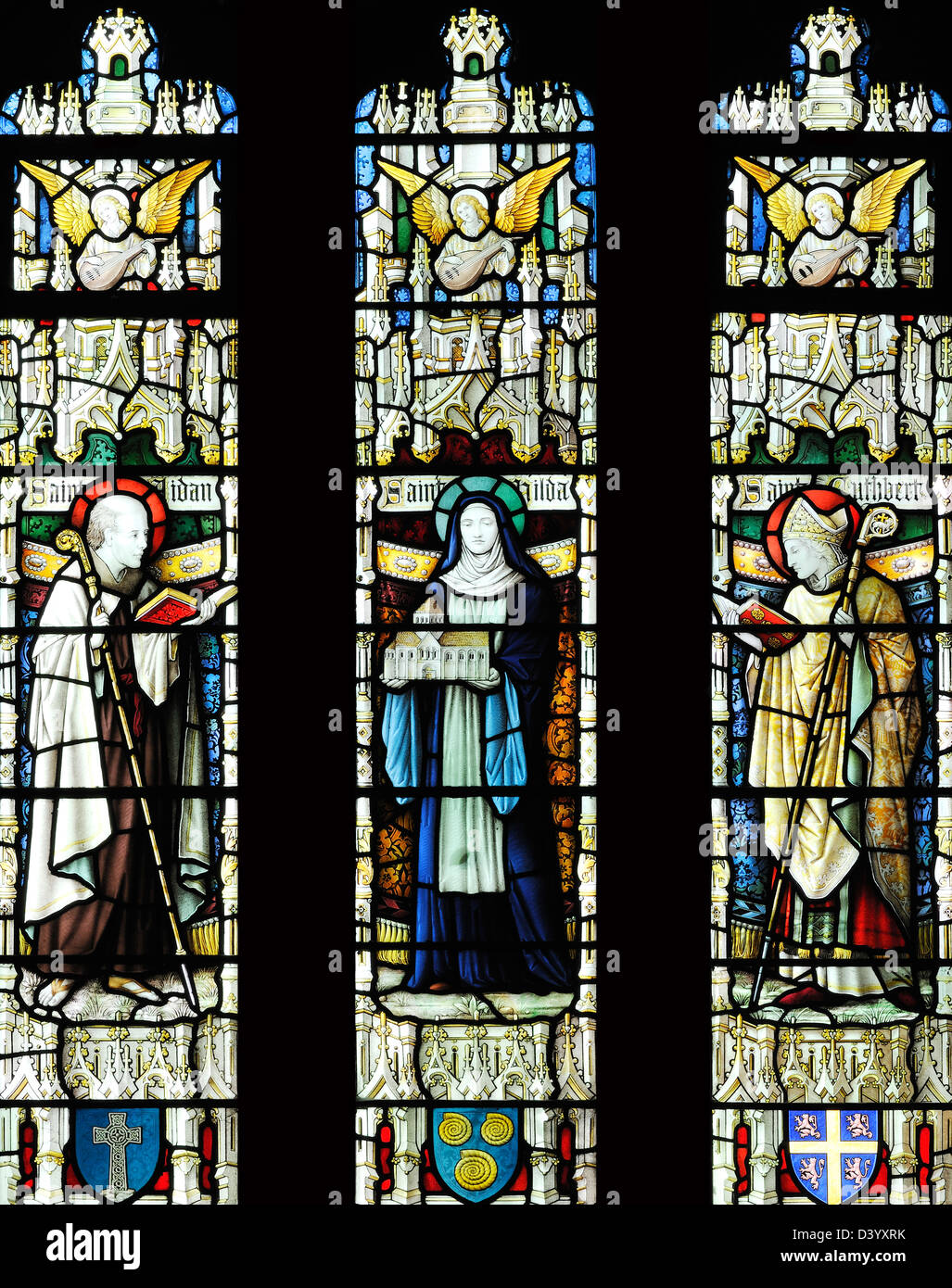 Stained glass window depicting Saints from the North East of England, the Parish Church of the Holy Trinity, Skipton, Yorkshire Stock Photo