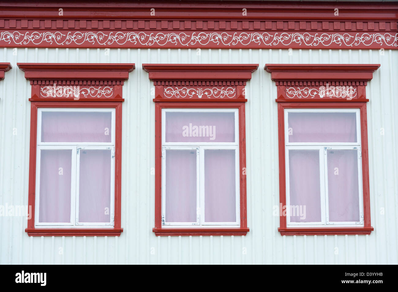 Detail of colourful painted windows on a traditional Icelandic building Gardur Iceland on the Reykanes peninsula Stock Photo