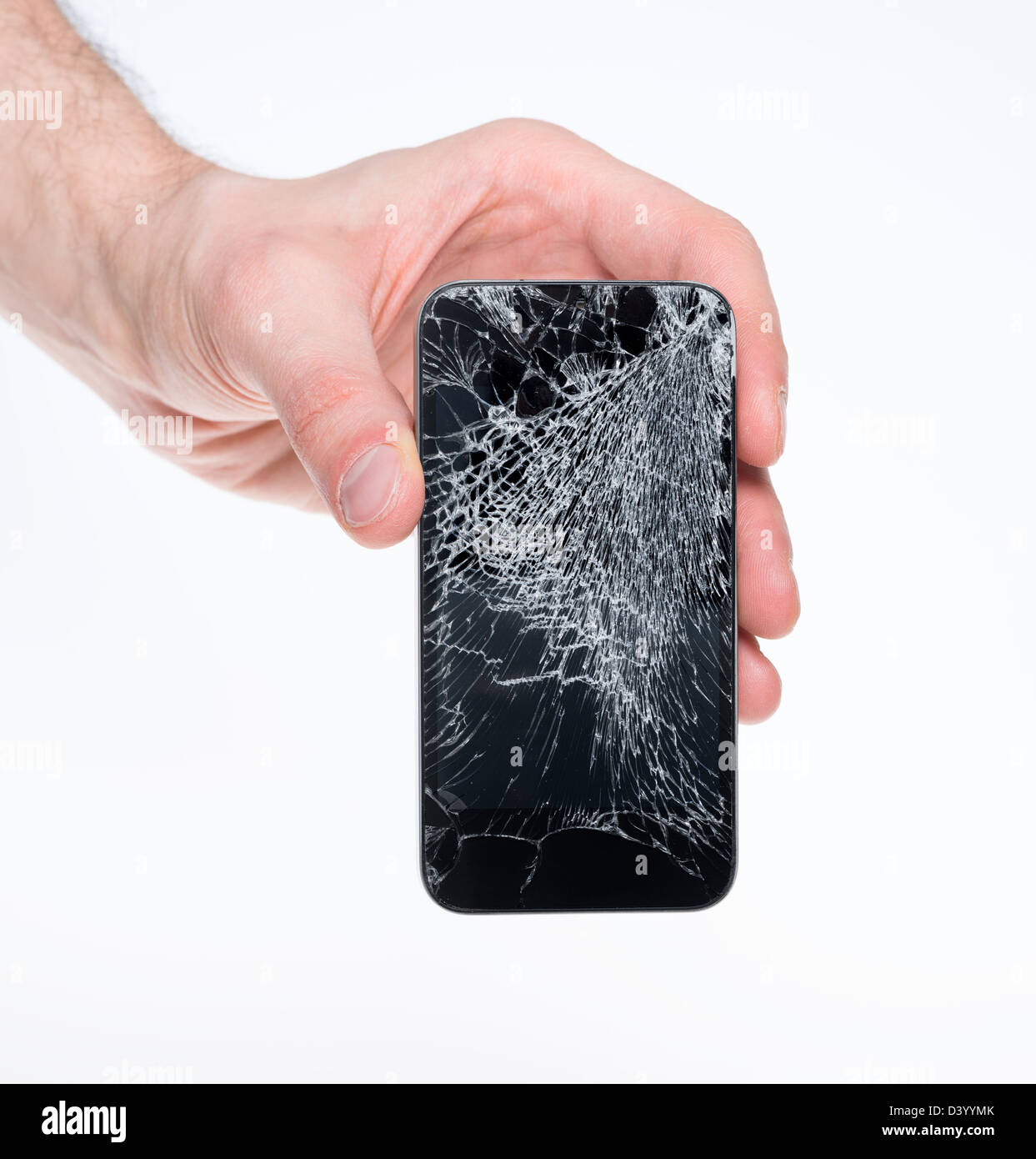 Studio closeup of a male hand, holding a smartphone with a cracked screen, isolated on a white background Stock Photo
