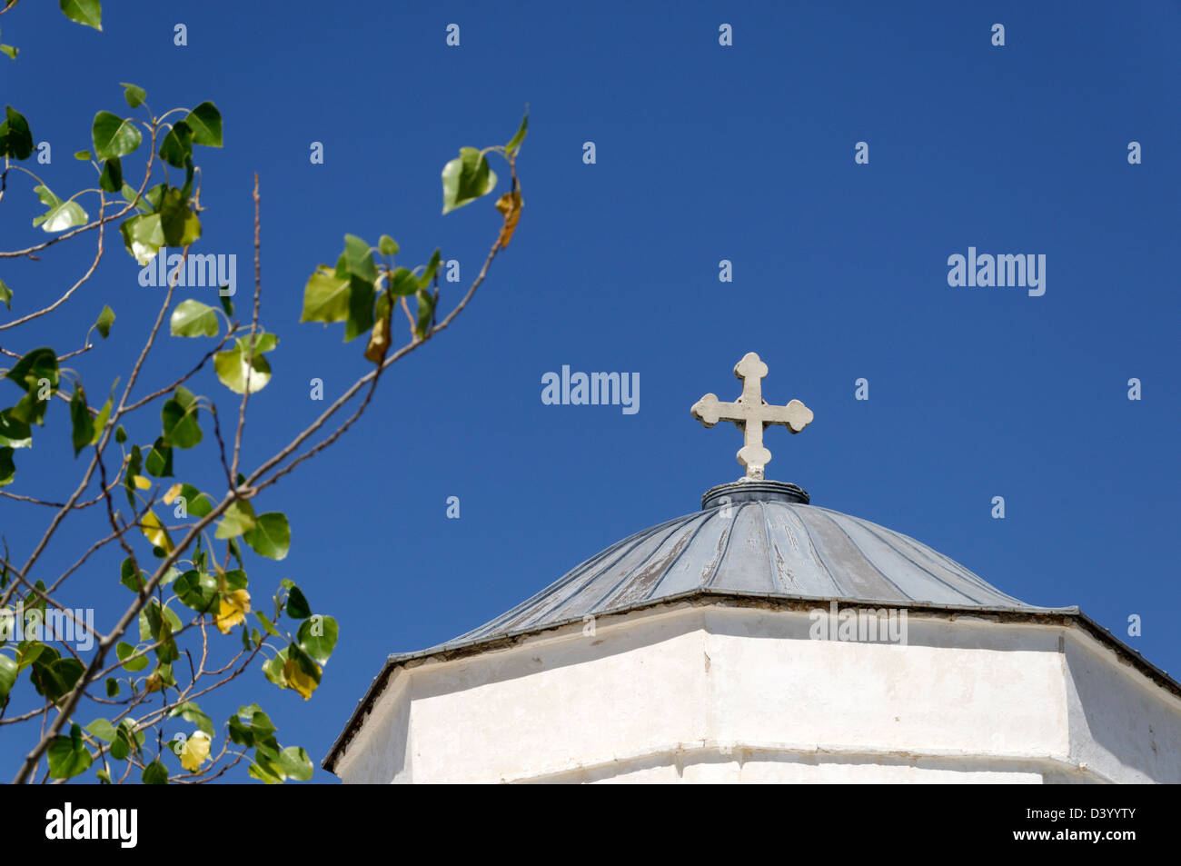 Naxos. Cyclades. Greece. Christian cross on the dome of Greek Church in the mountain village of Apiranthos Stock Photo