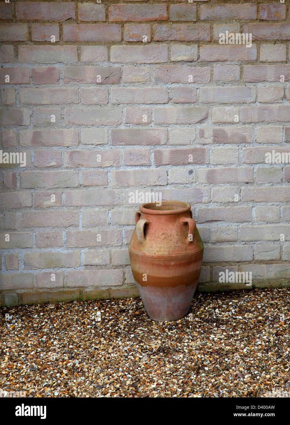 Plant pot against wall Stock Photo