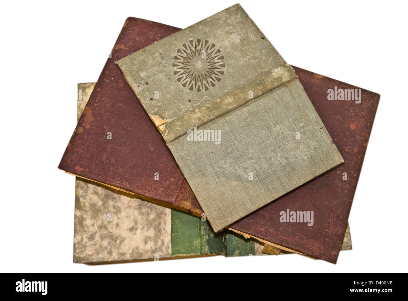 Three old books opened face down showing the front and back covers. Stock Photo