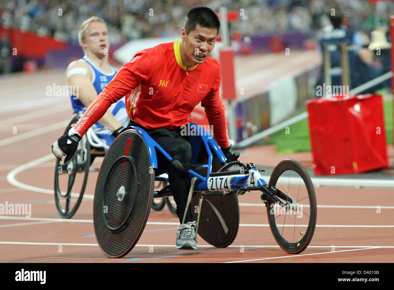 Lixin Zhang of China wins gold in the mens 400m - T54 in the Olympic ...