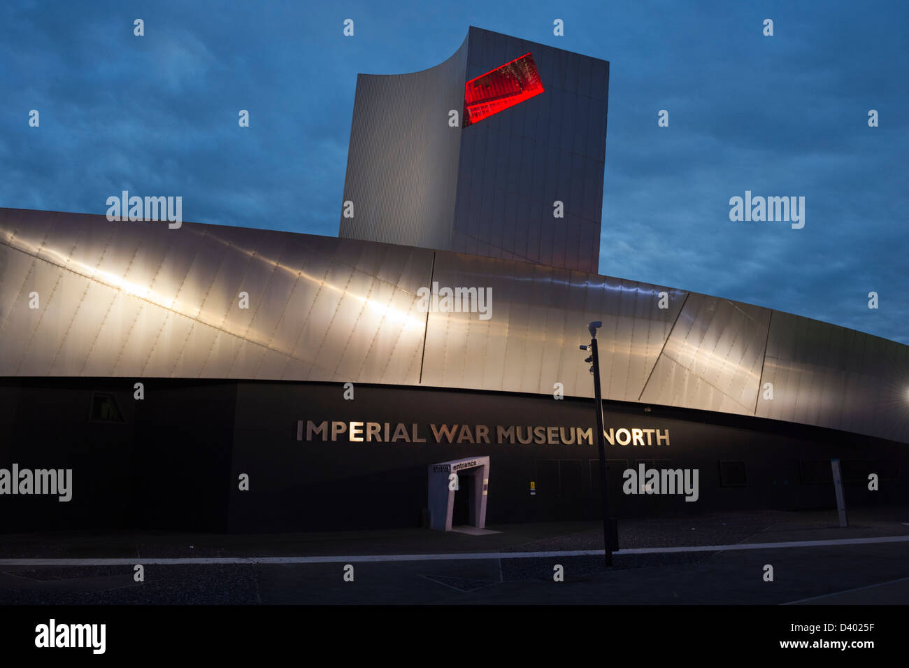 The Imperial War Museum North at Salford Quays, UK, at night. Stock Photo