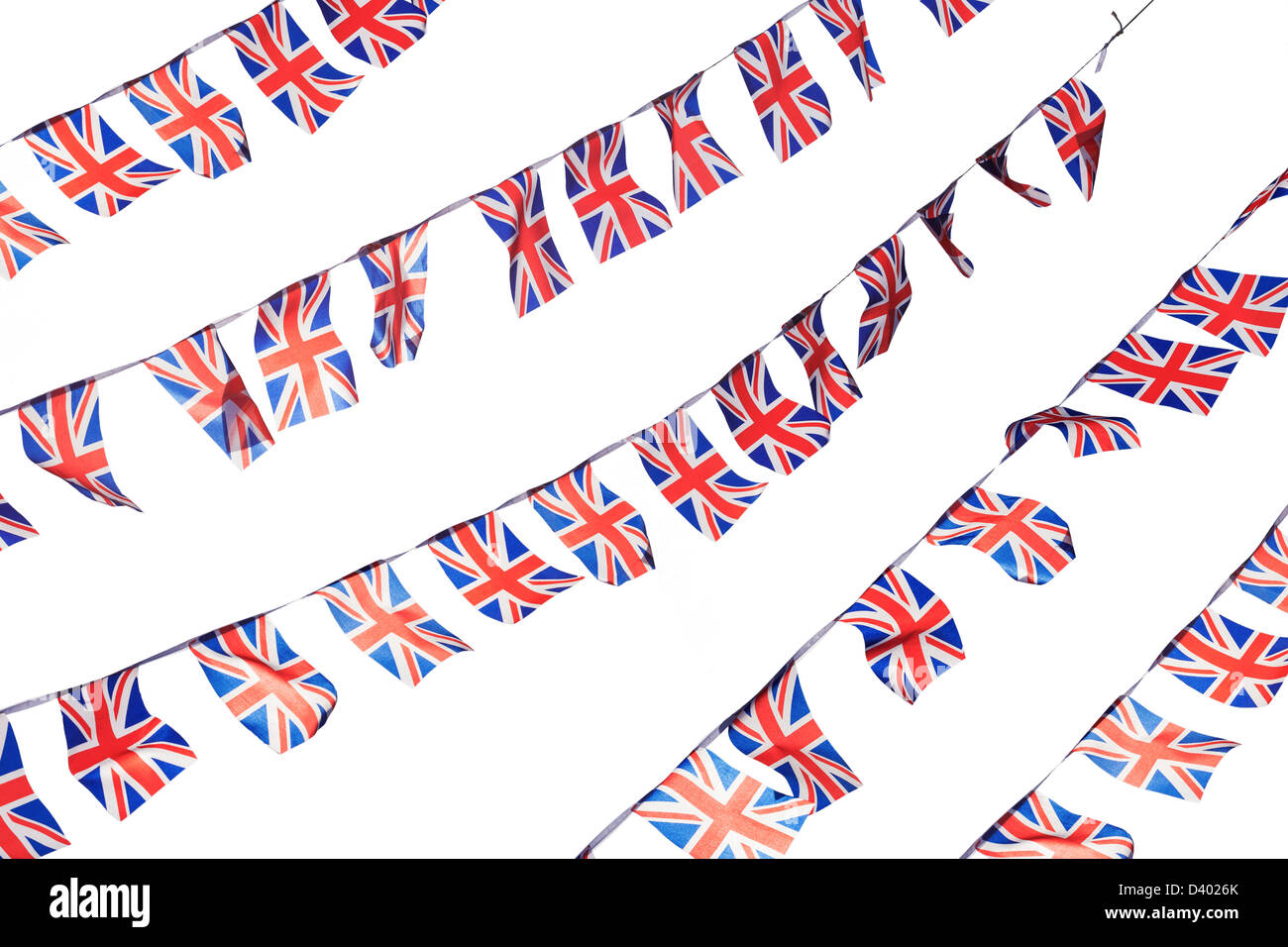 UK Union flag bunting flapping in the wind isolated on a white background Stock Photo