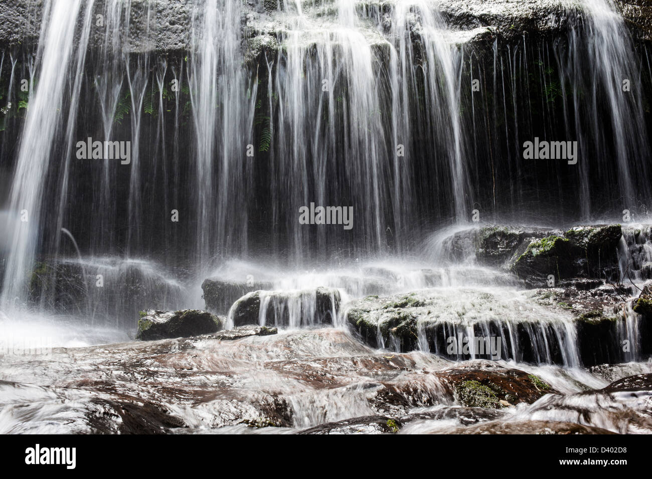 Close-up of cascading water at Sangara Falls, Iriomote Island, Okinawa Prefecture, Japan. Stock Photo