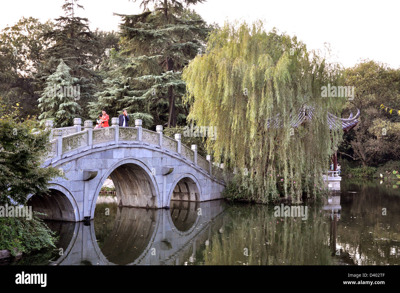 A traditional stone bridge over Hangzhou lake - Hangzhou near Shanghai China Stock Photo