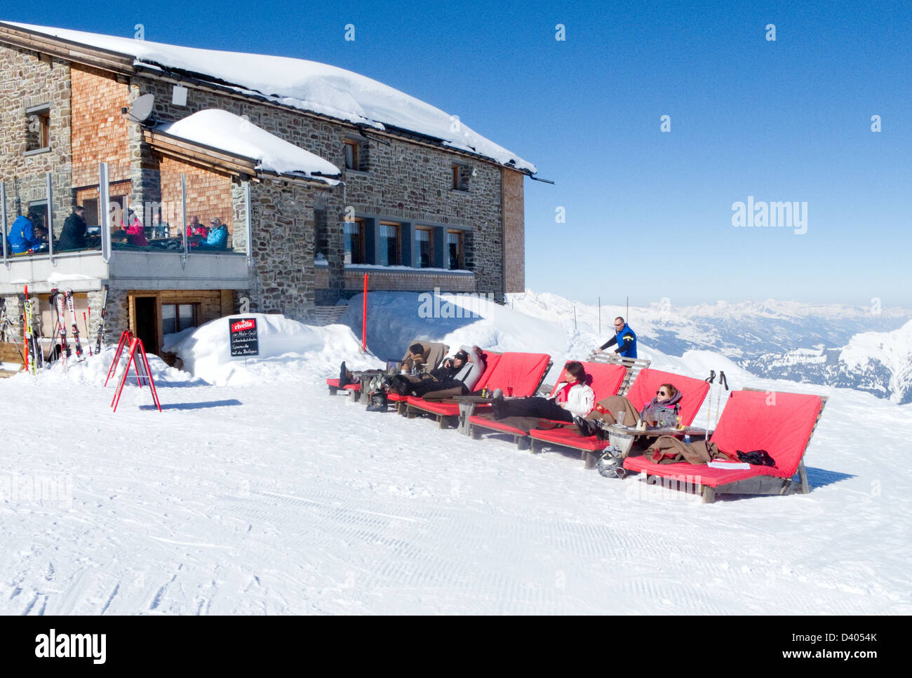 People skiing, - skiers having a rest break at Hornli Hutte, Arosa, the Alps, Switzerland europe Stock Photo