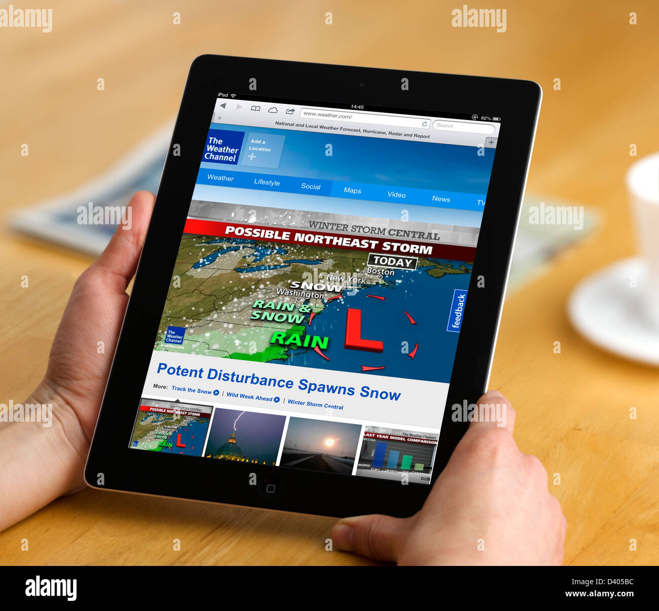 Looking at the forecast on the Weather Channel ( Weather.com ) on a 4th generation Apple iPad tablet computer Stock Photo