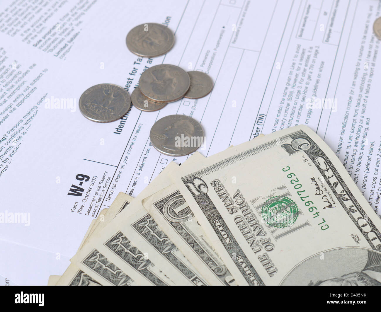 American dollars on W-9 income tax forms Stock Photo