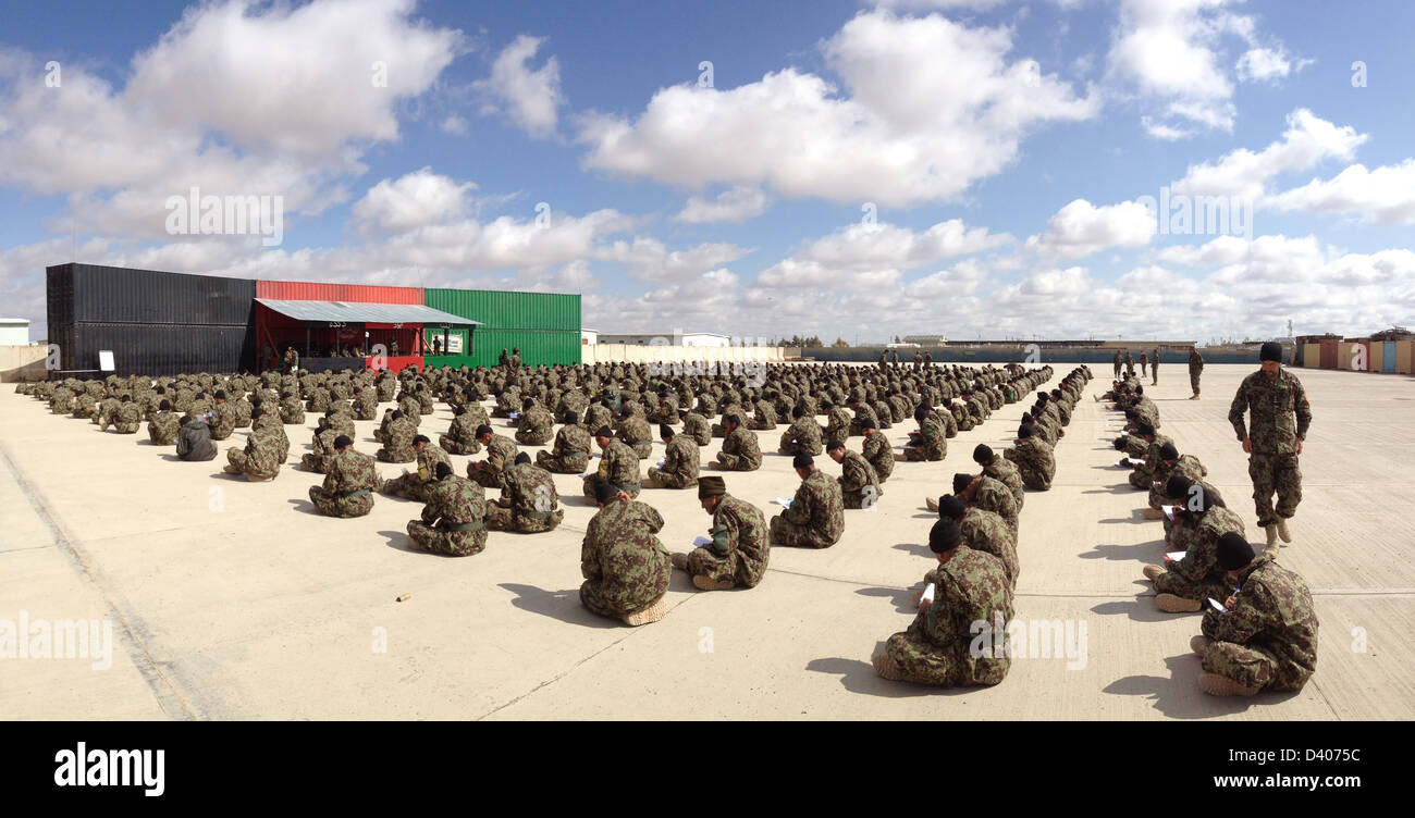 An Afghan National Army battalion commander at the Regional Military Training Center at Camp Shorabak monitors soldiers taking placement exams February 21, 2013 in Helmand province, Afghanistan. Stock Photo