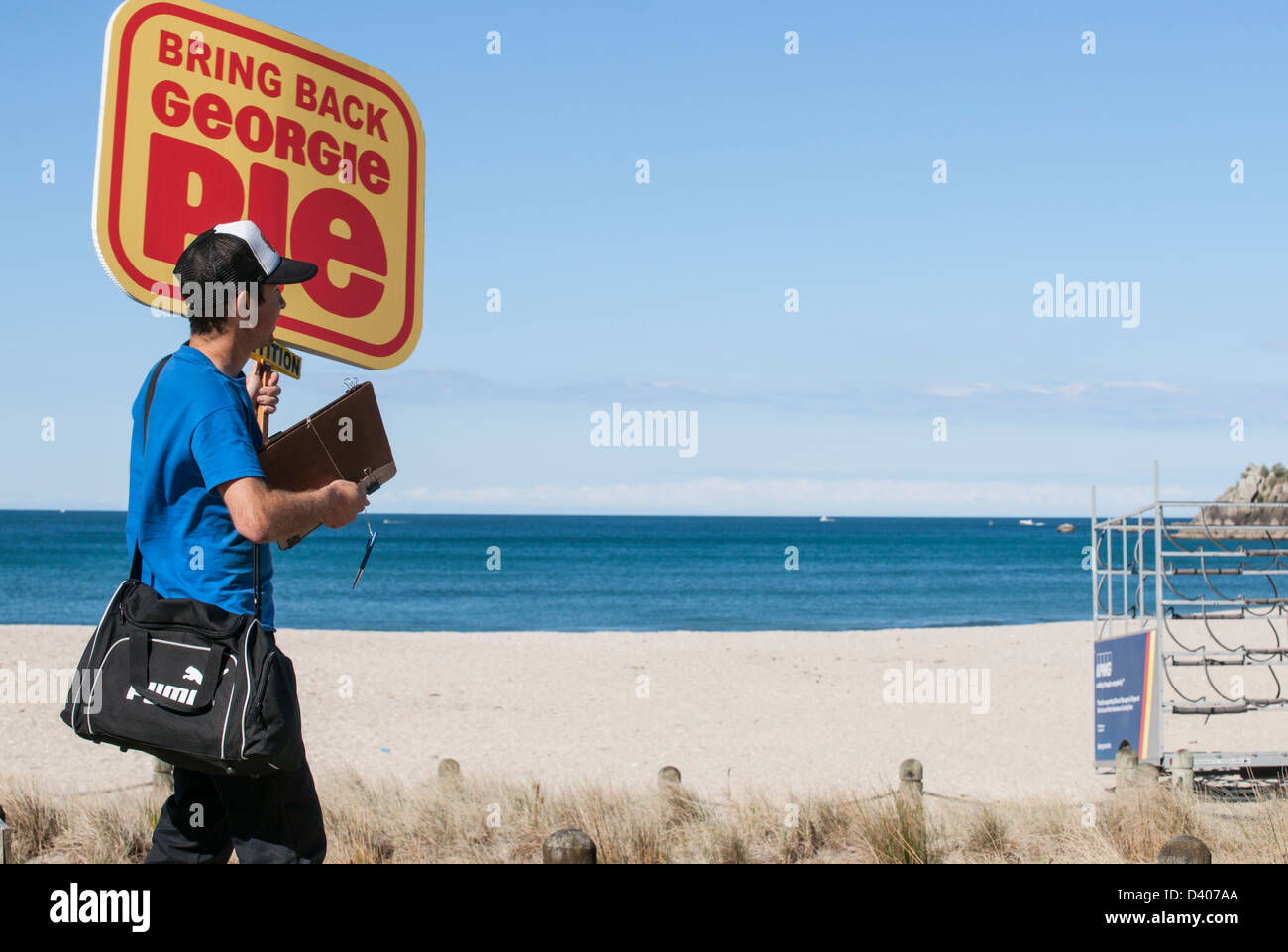 Carrying Sign Carrying a campaign sign Stock Photo - Alamy