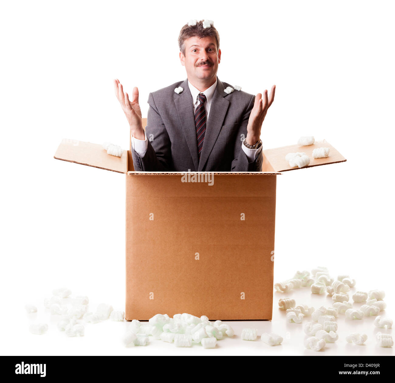 Businessman appears out of the shipping box Stock Photo