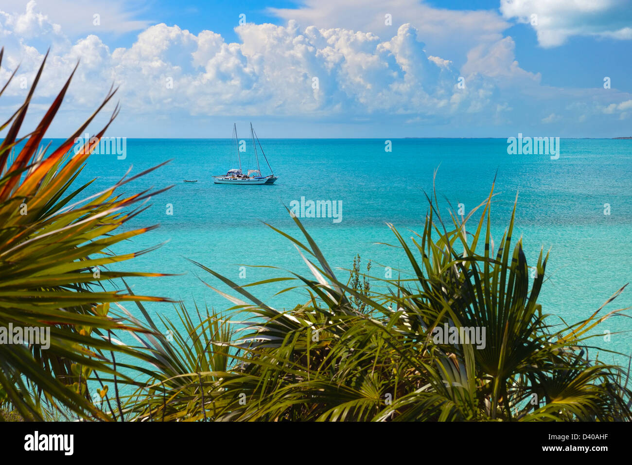 A Catamaran is anchored offshore of the Exuma Land and Sea Park, Exuma Island, Bahamas Stock Photo