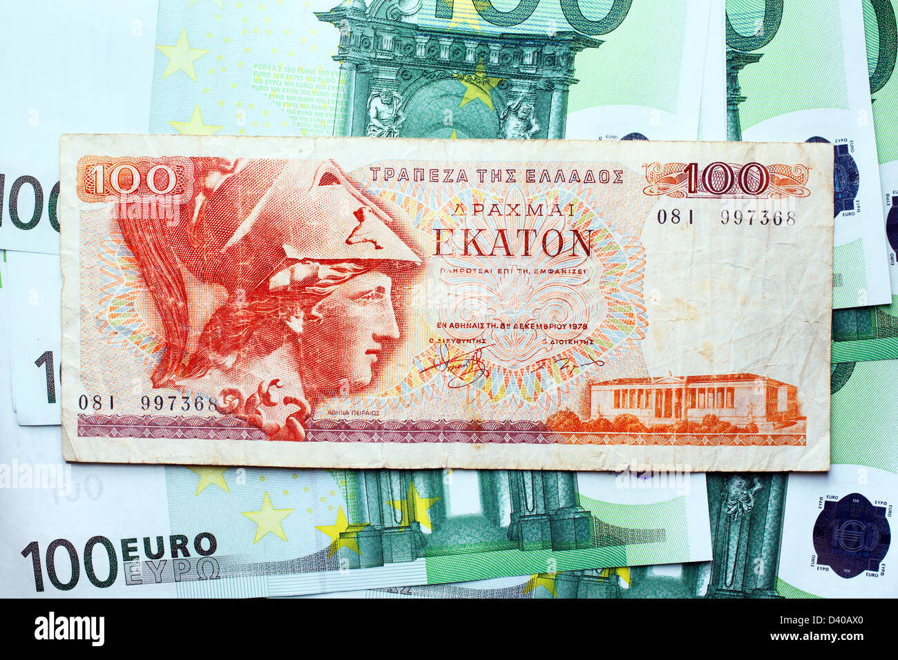 100 Drachmas banknote, Head of Athena Peiraios, Greece (1978) and modern 100 Euro banknotes as backround Stock Photo