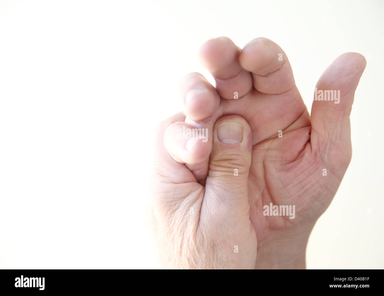 a man with soreness in his hand Stock Photo