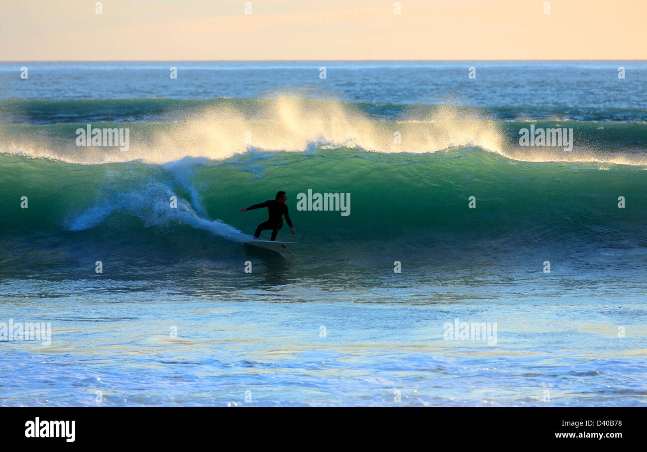 Surfing summer waves at Ngawi in Palliser Bay, south Wairarapa Stock Photo
