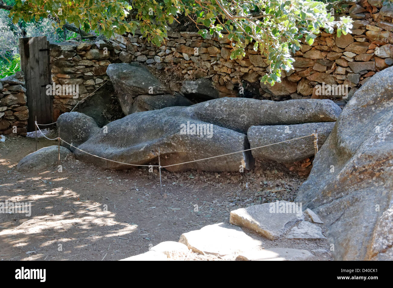 Naxos. Cyclades. Greece. The Kouros of Flerio lays abandoned in a garden in the ancient marble quarries of Melanes valley Stock Photo